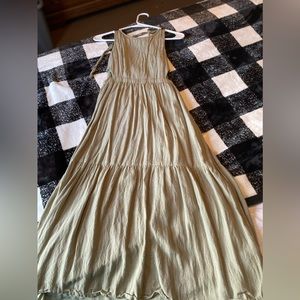 Long green dress with open back and open sides